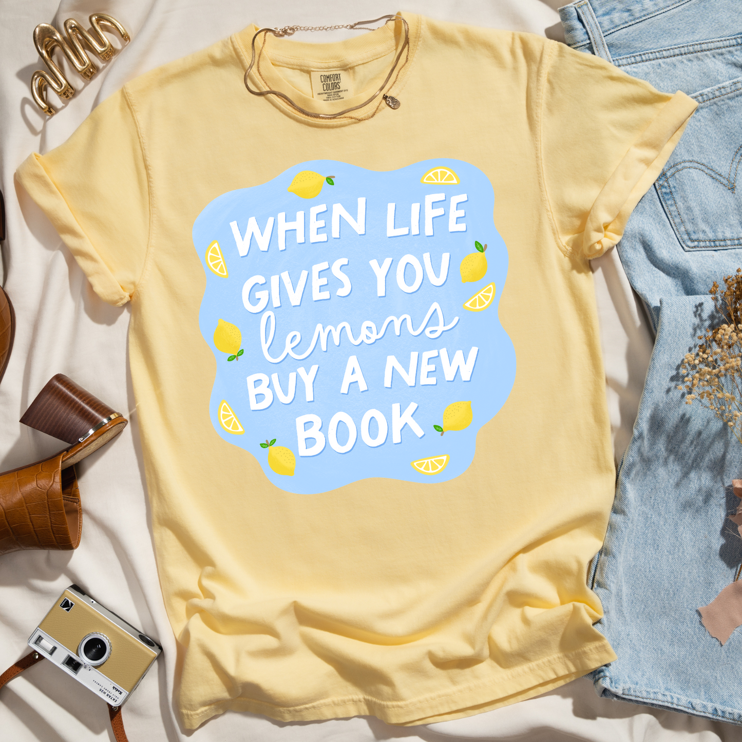 WHEN LIFE GIVES YOU LEMONS BUY A NEW BOOK TEE