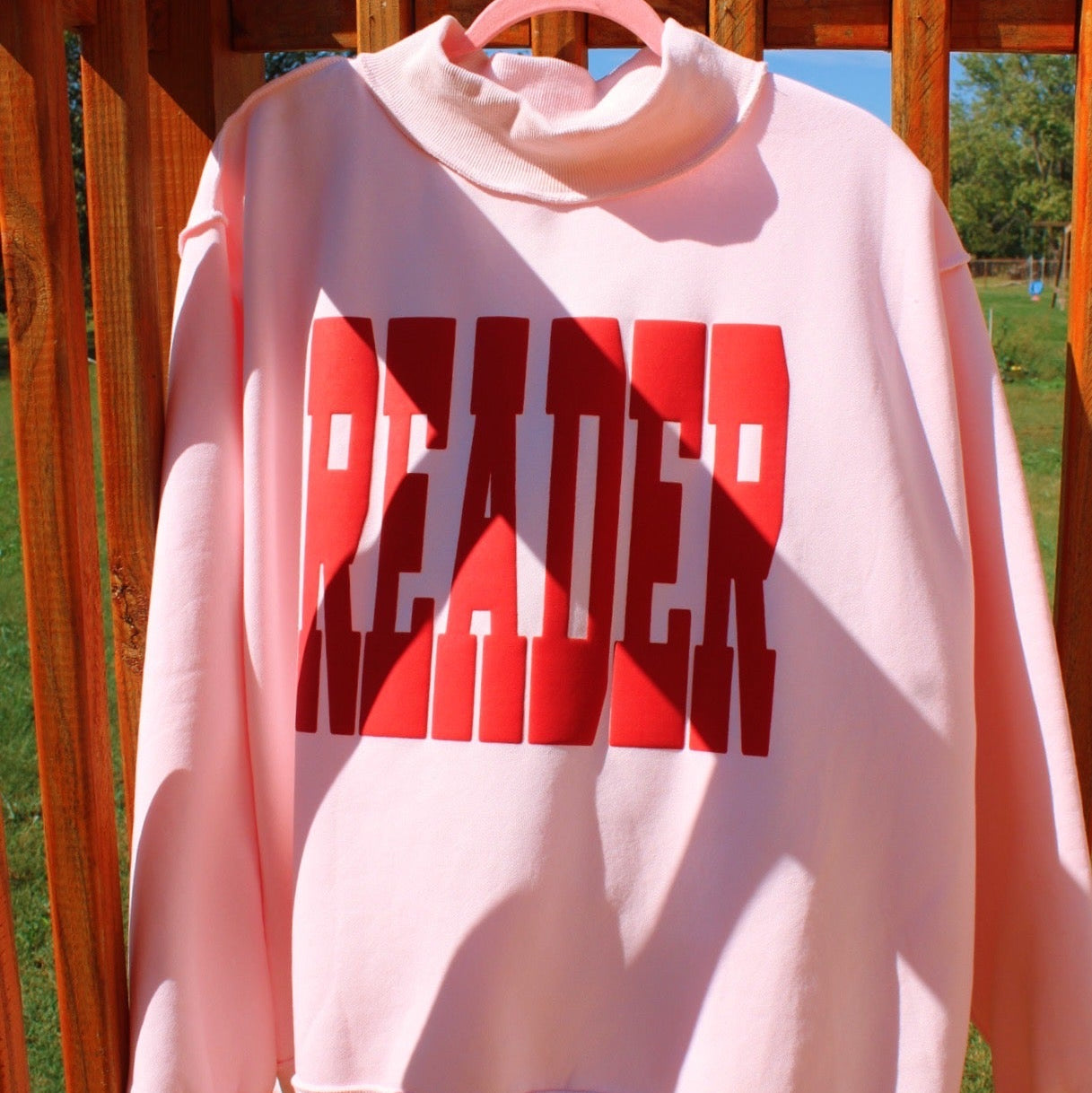 READER PUFF PRINT PINK MOCK NECK